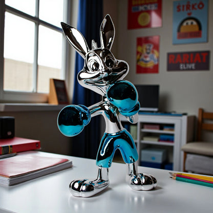 Resin bunny boxer figurine with chrome silver finish and aqua blue gloves and shorts