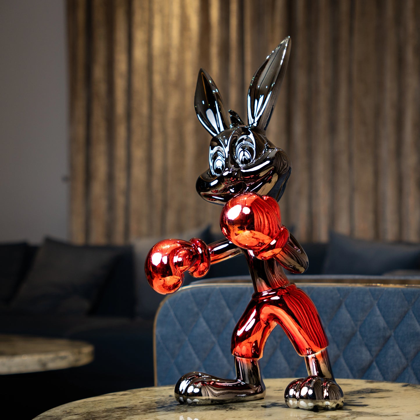 Resin bunny boxer figurine with chrome silver finish and crimson red gloves and shorts