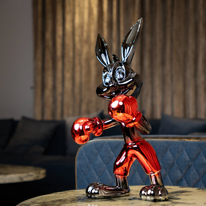 Resin bunny boxer figurine with chrome silver finish and crimson red gloves and shorts
