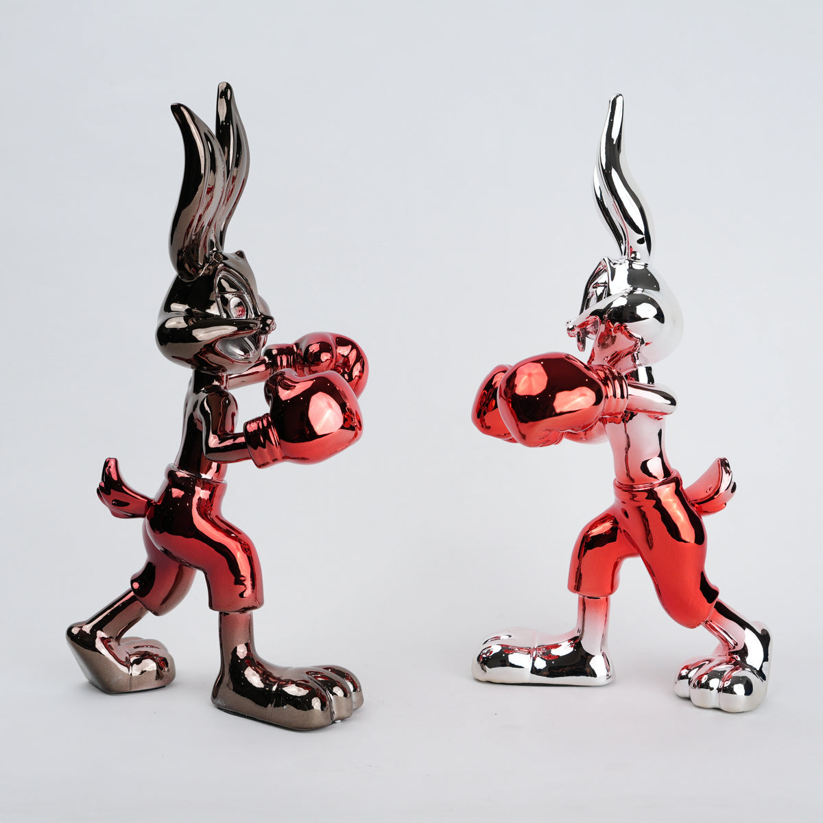 Resin bunny boxer figurine with chrome silver finish and crimson red gloves and shorts
