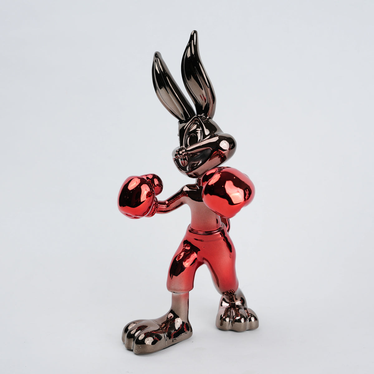 Resin bunny boxer figurine with chrome silver finish and crimson red gloves and shorts