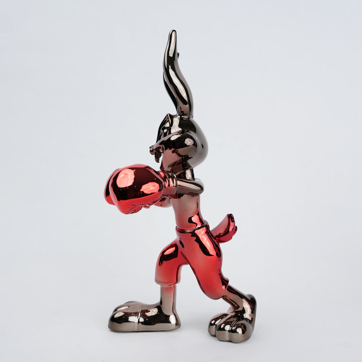 Resin bunny boxer figurine with chrome silver finish and crimson red gloves and shorts