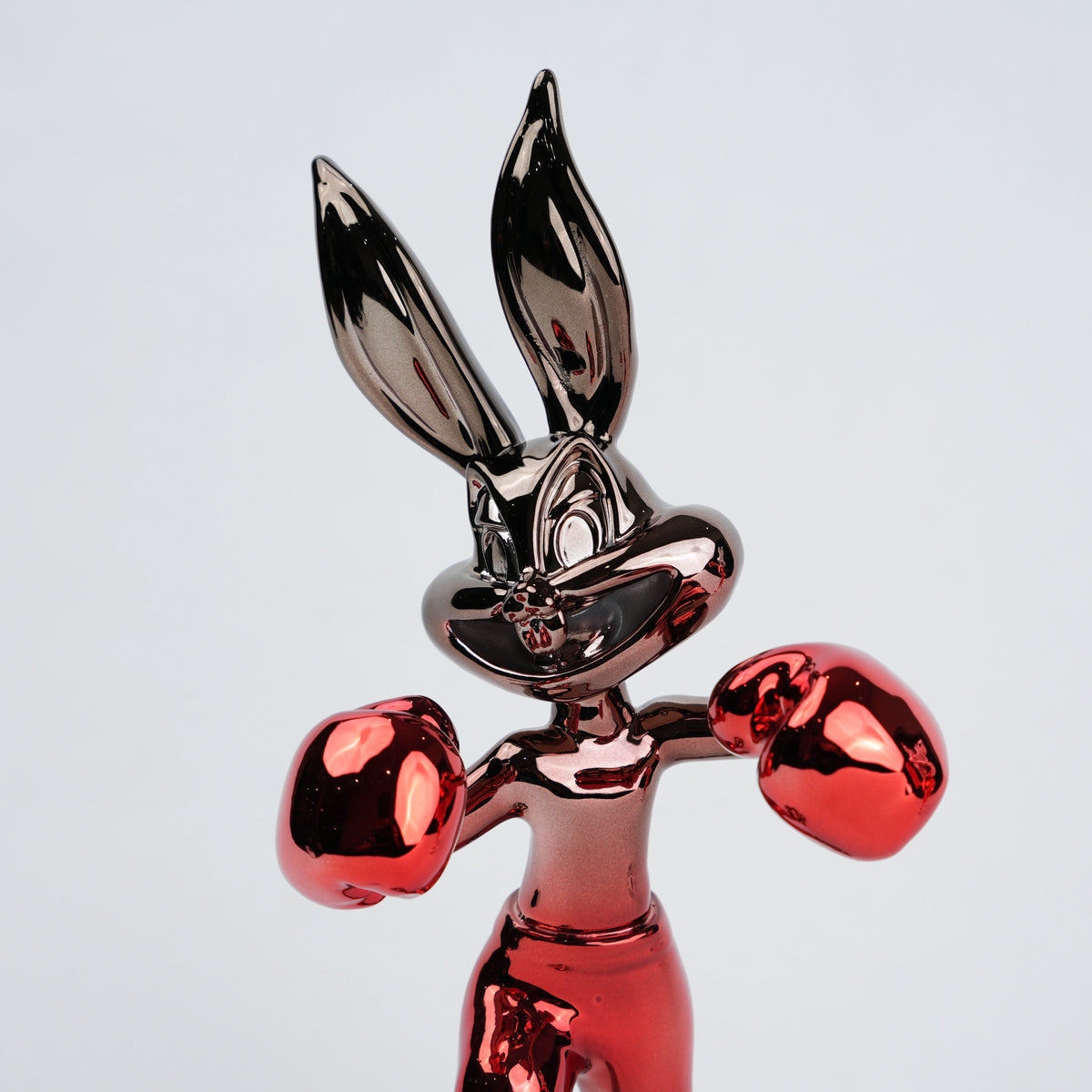 Resin bunny boxer figurine with chrome silver finish and crimson red gloves and shorts