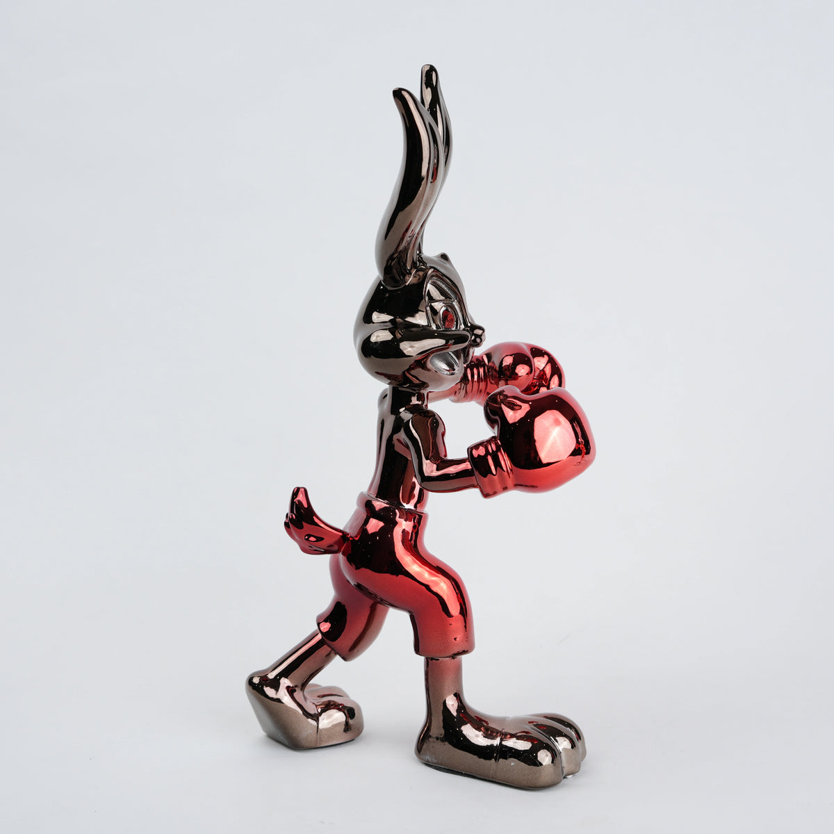 Resin bunny boxer figurine with chrome silver finish and crimson red gloves and shorts