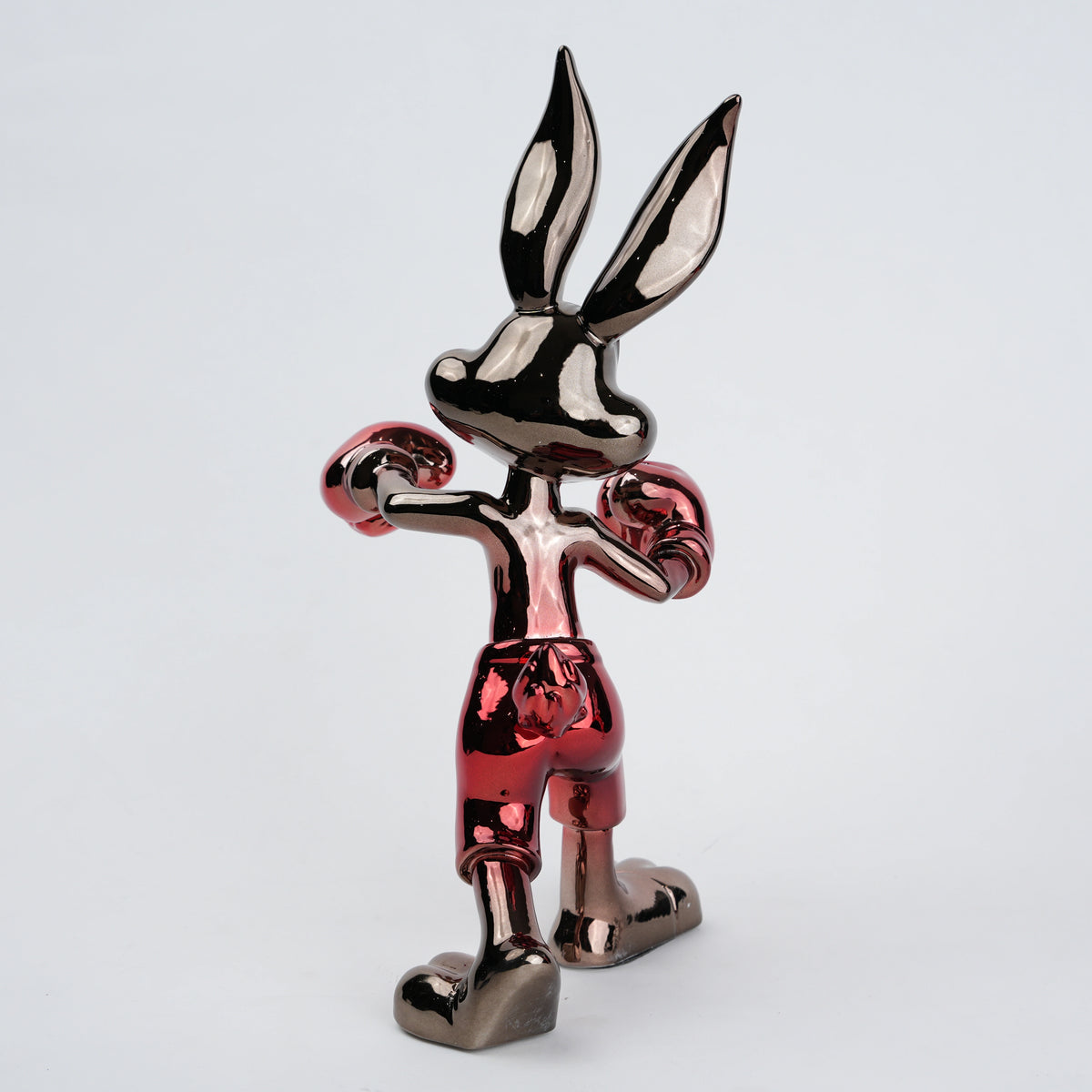 Resin bunny boxer figurine with chrome silver finish and crimson red gloves and shorts
