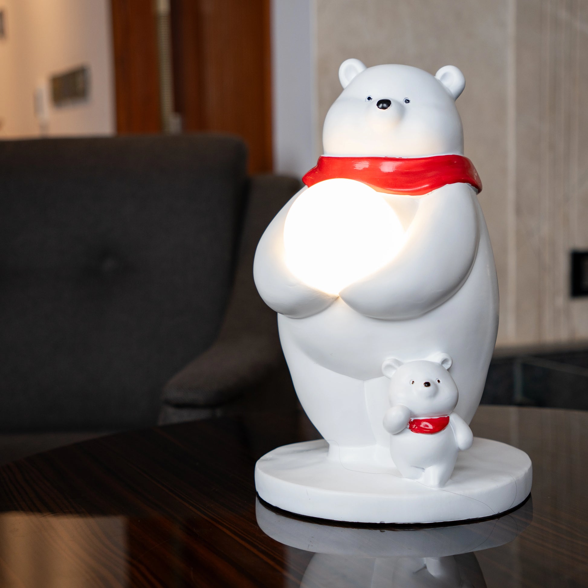 White ceramic polar-bear lamp with glowing orb and cub — Polar Glow Lamp by Ghar Art, handcrafted modern home-decor lighting for cozy and luxury interiors.
