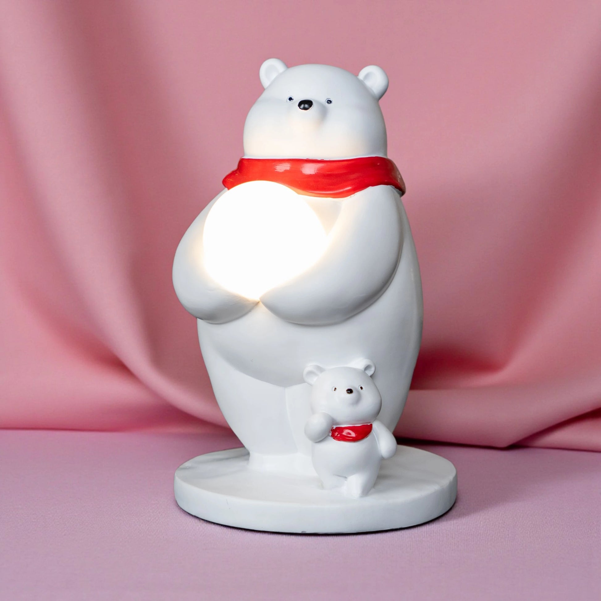 White ceramic polar-bear lamp with glowing orb and cub — Polar Glow Lamp by Ghar Art, handcrafted modern home-decor lighting for cozy and luxury interiors.