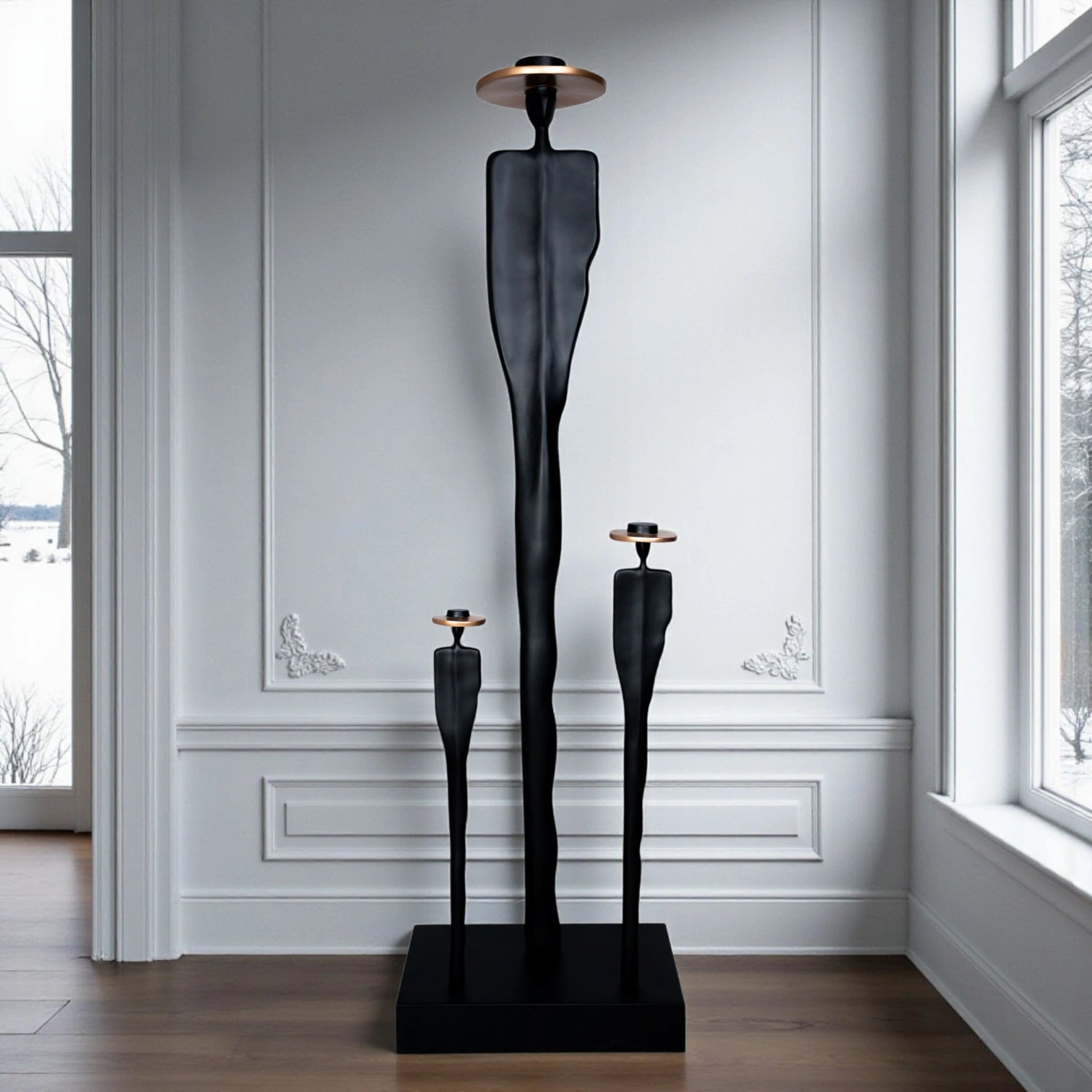Tall matte black resin sculpture of three elongated human figures with bronze hats — Ethereal Harmony Sculpture by Ghar Art, handcrafted luxury decor symbolizing unity and balance.