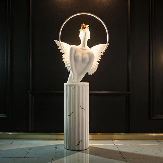 White angelic sculpture with wings, gold crown, and LED halo on marble-style base — Heavenly Wing Sculpture by Ghar Art, handcrafted luxury home decor accent symbolizing peace and divinity.