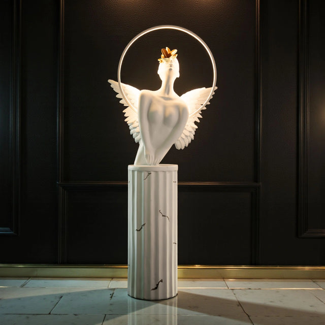 White angelic sculpture with wings, gold crown, and LED halo on marble-style base — Heavenly Wing Sculpture by Ghar Art, handcrafted luxury home decor accent symbolizing peace and divinity.