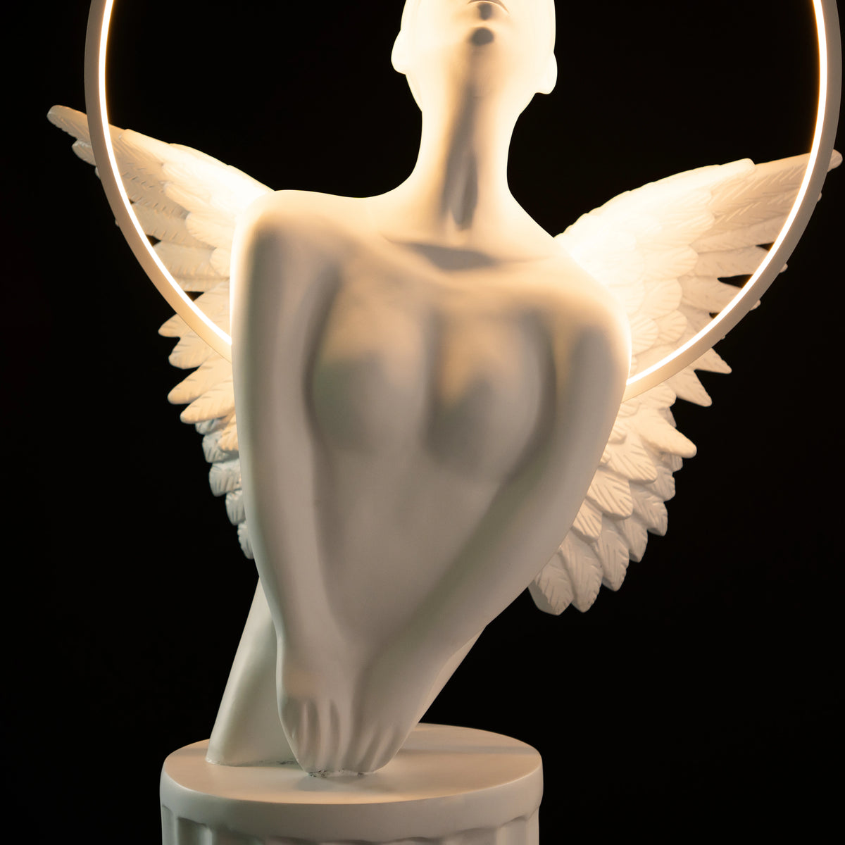 White angelic sculpture with wings, gold crown, and LED halo on marble-style base — Heavenly Wing Sculpture by Ghar Art, handcrafted luxury home decor accent symbolizing peace and divinity.