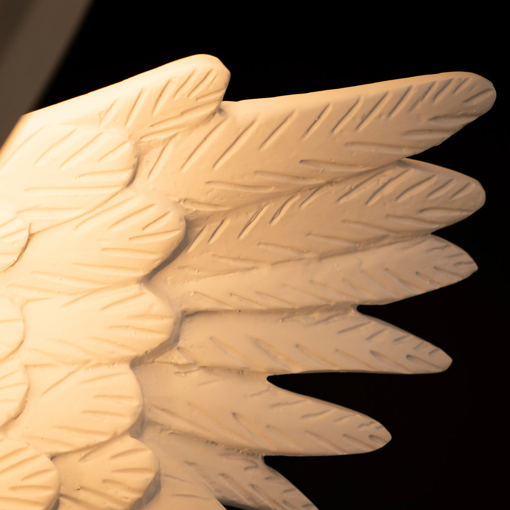 White angelic sculpture with wings, gold crown, and LED halo on marble-style base — Heavenly Wing Sculpture by Ghar Art, handcrafted luxury home decor accent symbolizing peace and divinity.