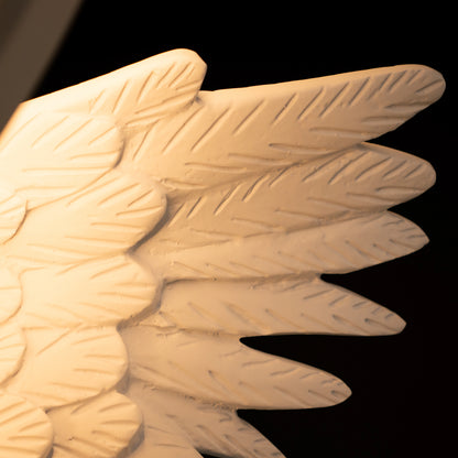 White angelic sculpture with wings, gold crown, and LED halo on marble-style base — Heavenly Wing Sculpture by Ghar Art, handcrafted luxury home decor accent symbolizing peace and divinity.