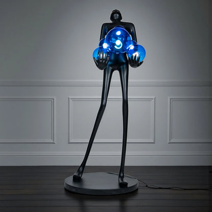 Tall matte black sculpture of human figure holding glowing blue light spheres — Azure Radiance Sculpture by Ghar Art, handcrafted illuminated modern home decor accent.