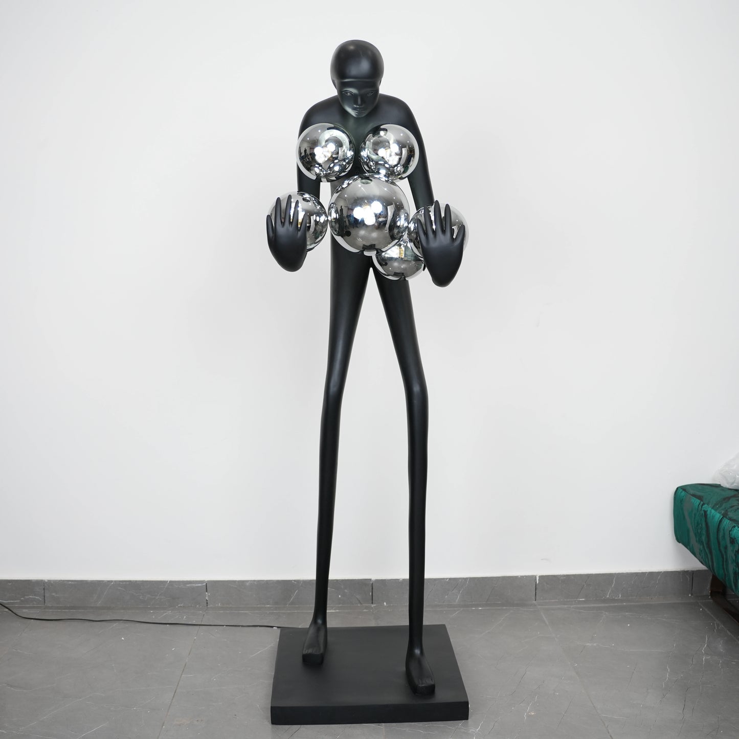 Glow figure lamp, chrome globes, showroom