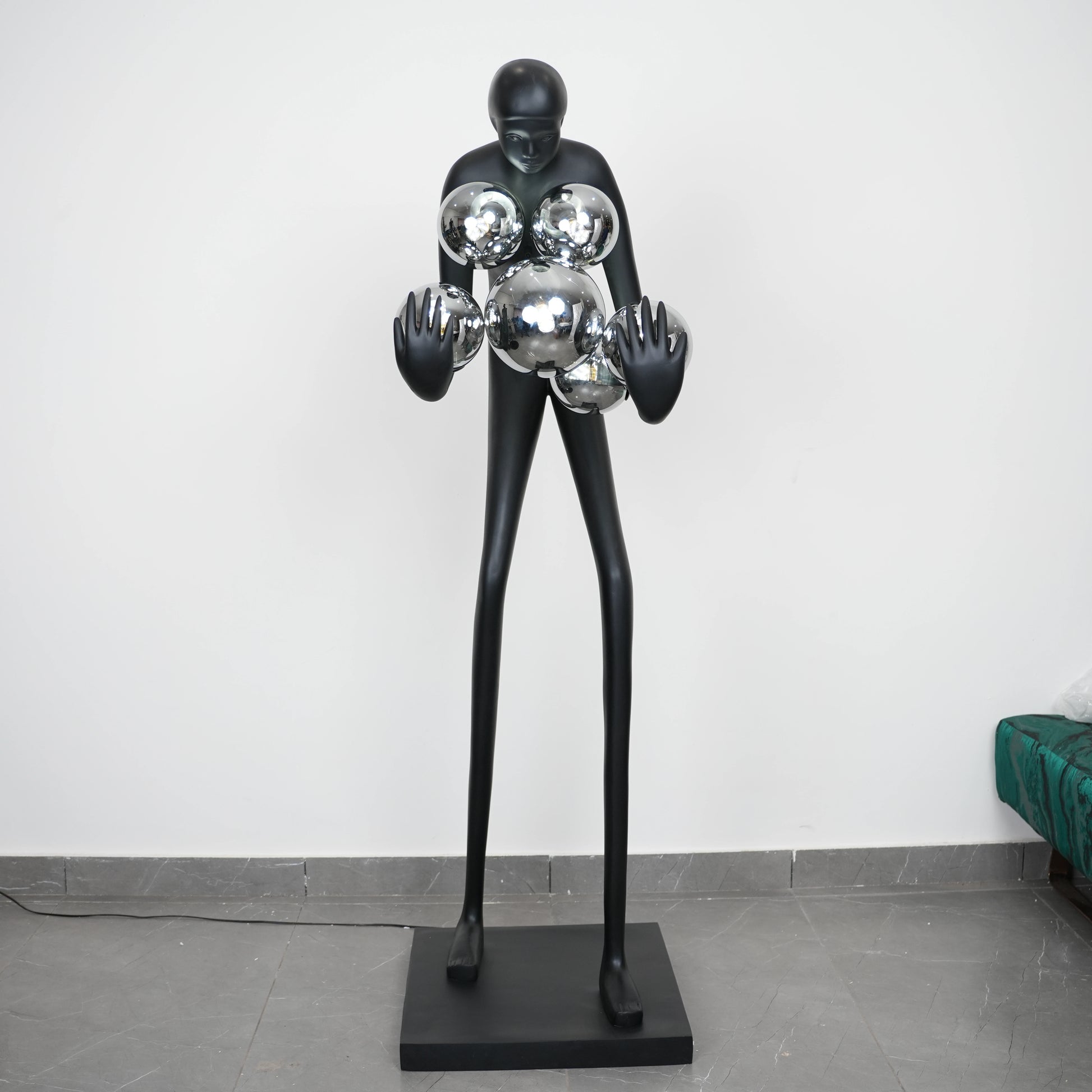 Glow figure lamp, chrome globes, showroom