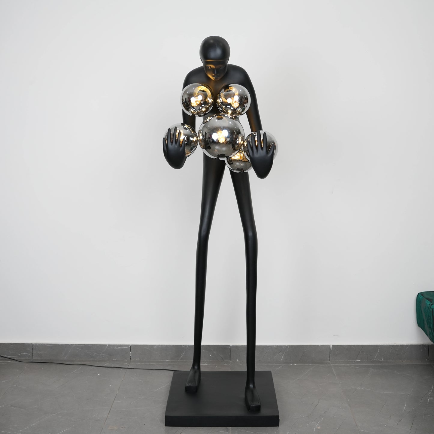 Glow figure lamp, chrome orbs, front shot