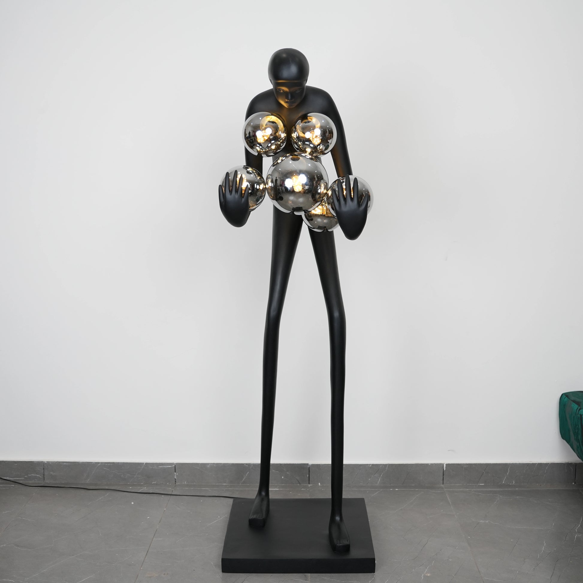 Glow figure lamp, chrome orbs, front shot
