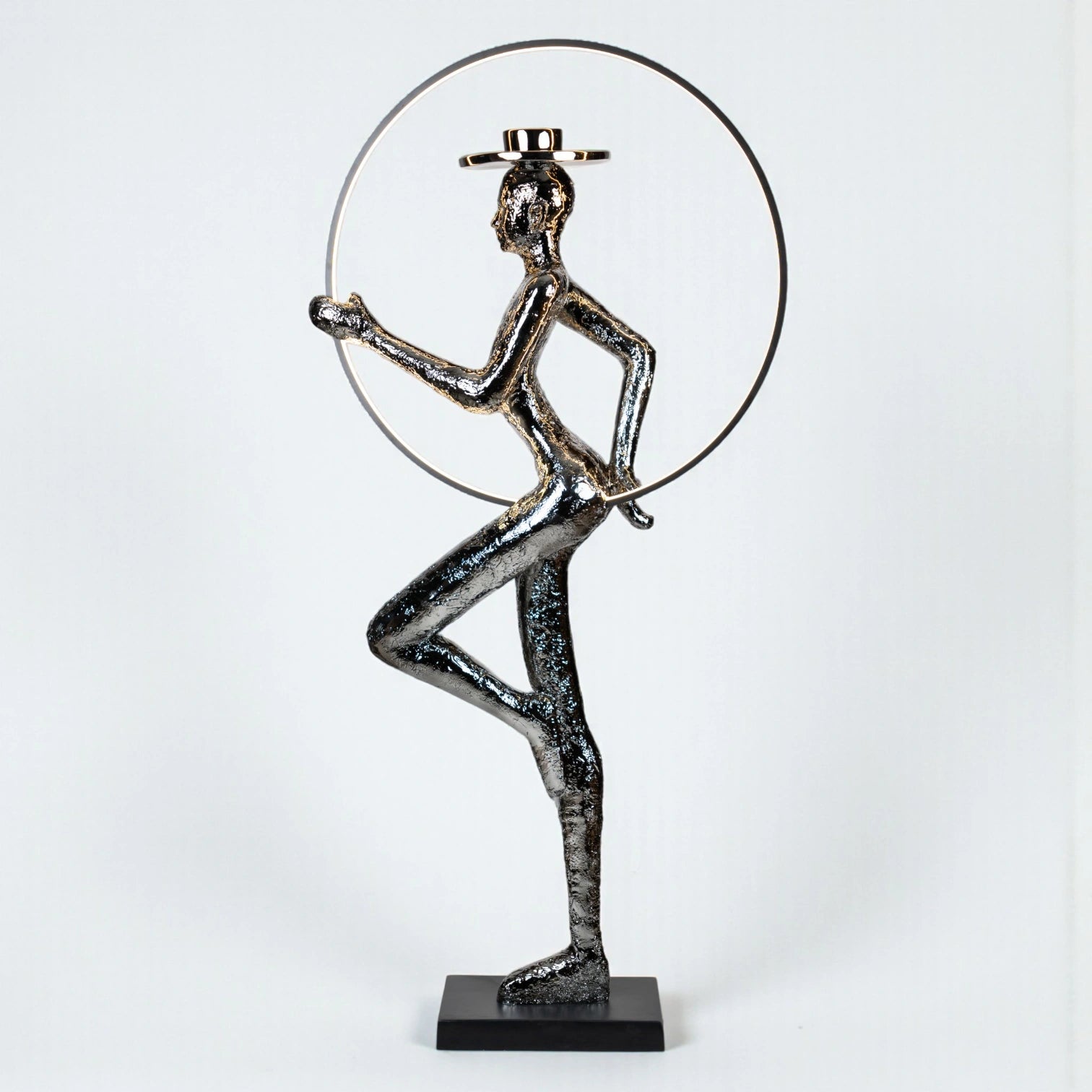 Silver electroplated human sculpture with glowing LED halo — Auric Poise Sculpture by Ghar Art, handcrafted metallic luxury home decor accent symbolizing balance and radiance.