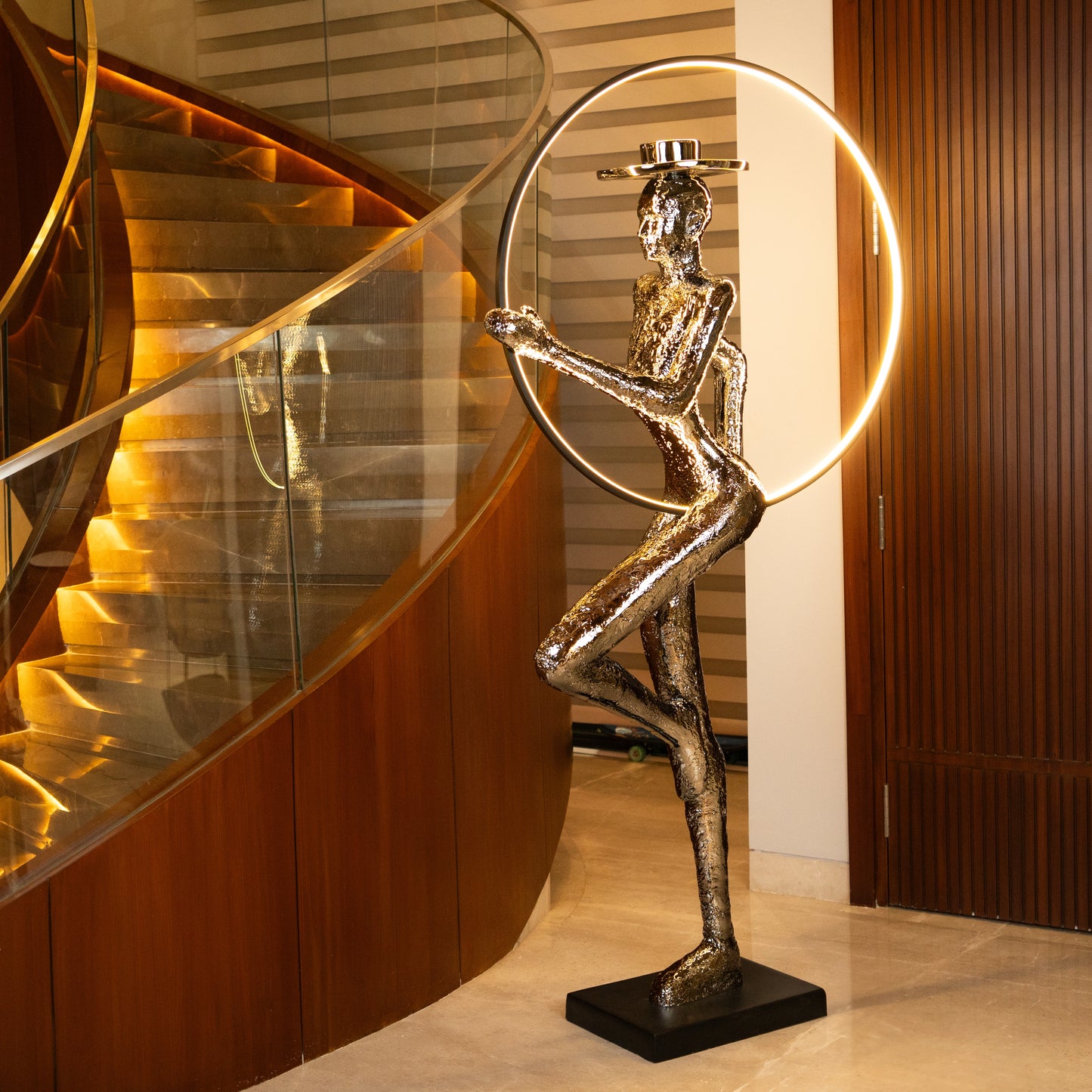 Silver electroplated human sculpture with glowing LED halo — Auric Poise Sculpture by Ghar Art, handcrafted metallic luxury home decor accent symbolizing balance and radiance.