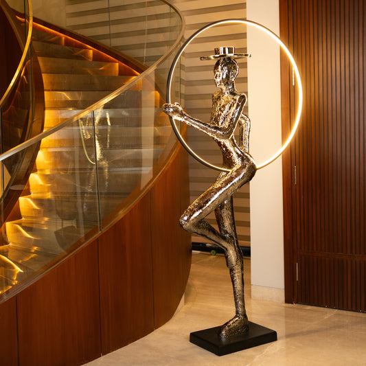 Silver electroplated human sculpture with glowing LED halo — Auric Poise Sculpture by Ghar Art, handcrafted metallic luxury home decor accent symbolizing balance and radiance.