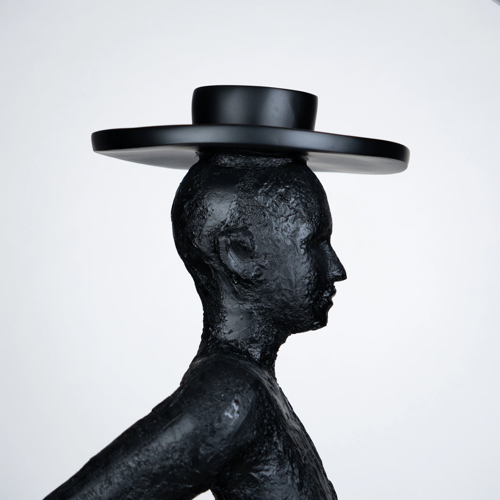 Tall black resin luminous poise sculpture with glowing LED halo — The Illuminated Voyager Sculpture by Ghar Art, handcrafted luxury home decor, 190 cm tall statement art piece.
