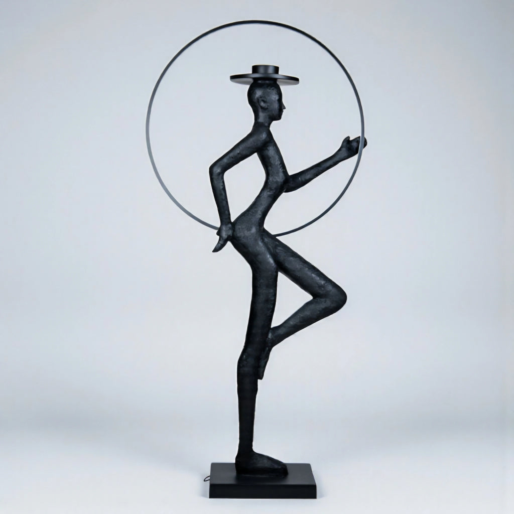 Tall black resin luminous poise sculpture with glowing LED halo — The Illuminated Voyager Sculpture by Ghar Art, handcrafted luxury home decor, 190 cm tall statement art piece.
