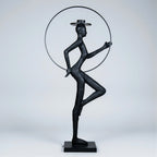 Tall black resin luminous poise sculpture with glowing LED halo — The Illuminated Voyager Sculpture by Ghar Art, handcrafted luxury home decor, 190 cm tall statement art piece.