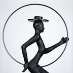 Tall black resin luminous poise sculpture with glowing LED halo — The Illuminated Voyager Sculpture by Ghar Art, handcrafted luxury home decor, 190 cm tall statement art piece.