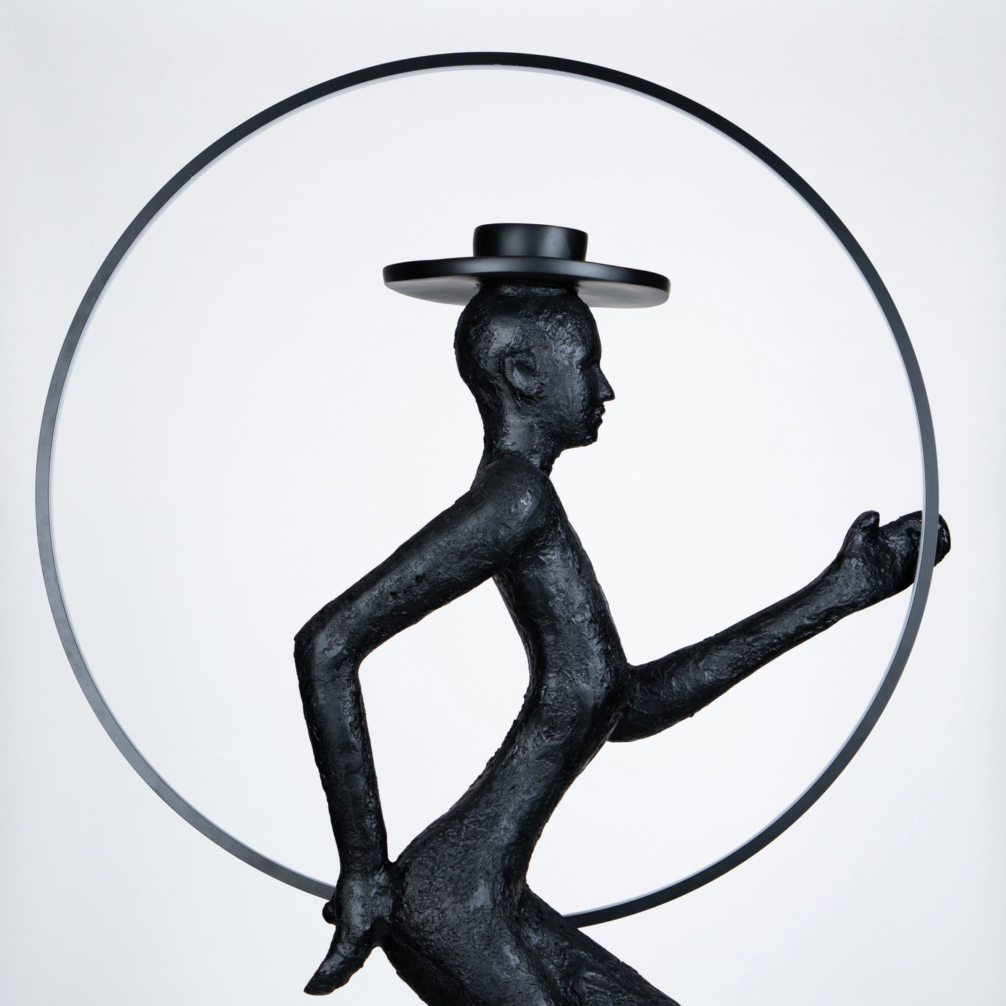 Tall black resin luminous poise sculpture with glowing LED halo — The Illuminated Voyager Sculpture by Ghar Art, handcrafted luxury home decor, 190 cm tall statement art piece.