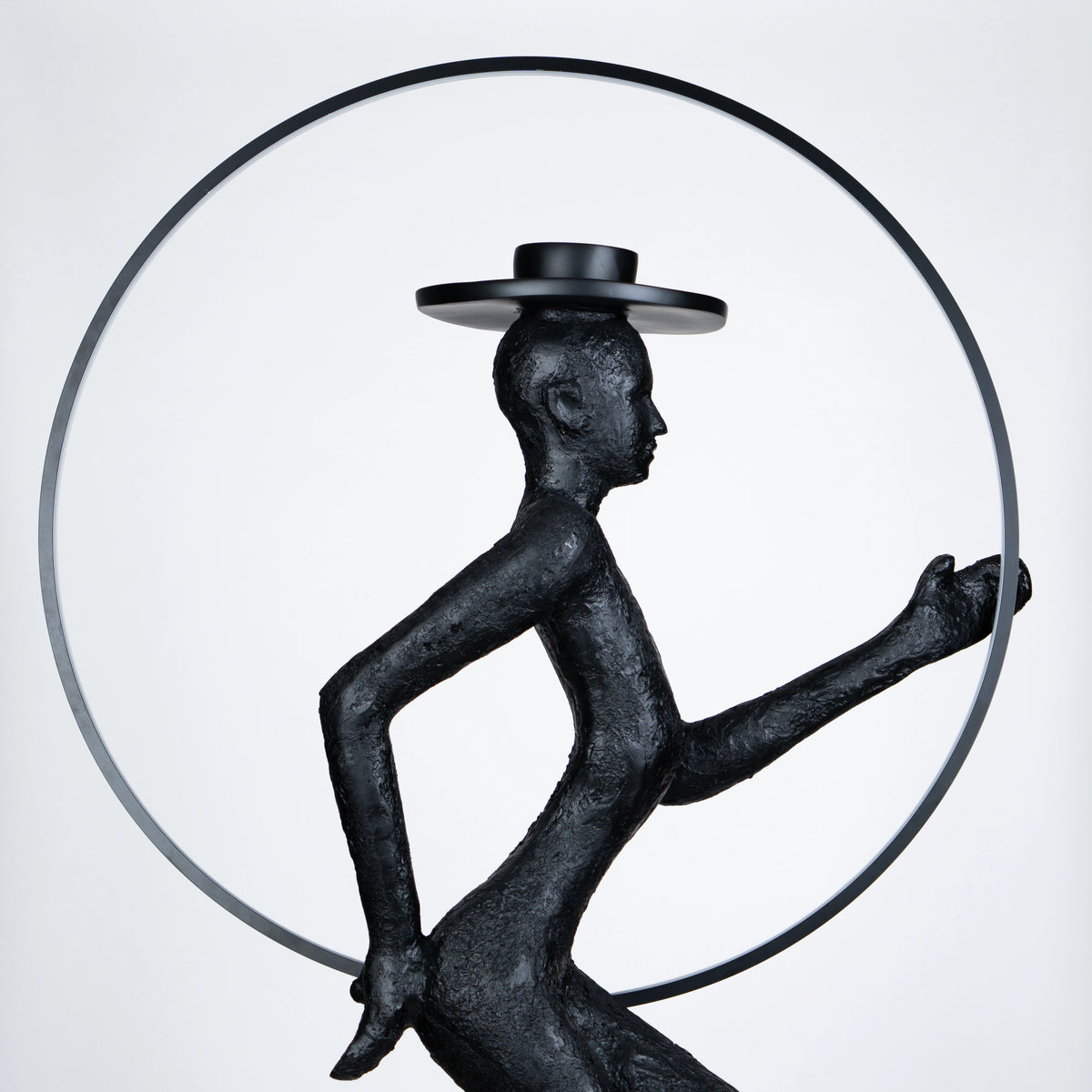 Tall black resin luminous poise sculpture with glowing LED halo — The Illuminated Voyager Sculpture by Ghar Art, handcrafted luxury home decor, 190 cm tall statement art piece.