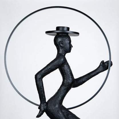 Tall black resin luminous poise sculpture with glowing LED halo — The Illuminated Voyager Sculpture by Ghar Art, handcrafted luxury home decor, 190 cm tall statement art piece.