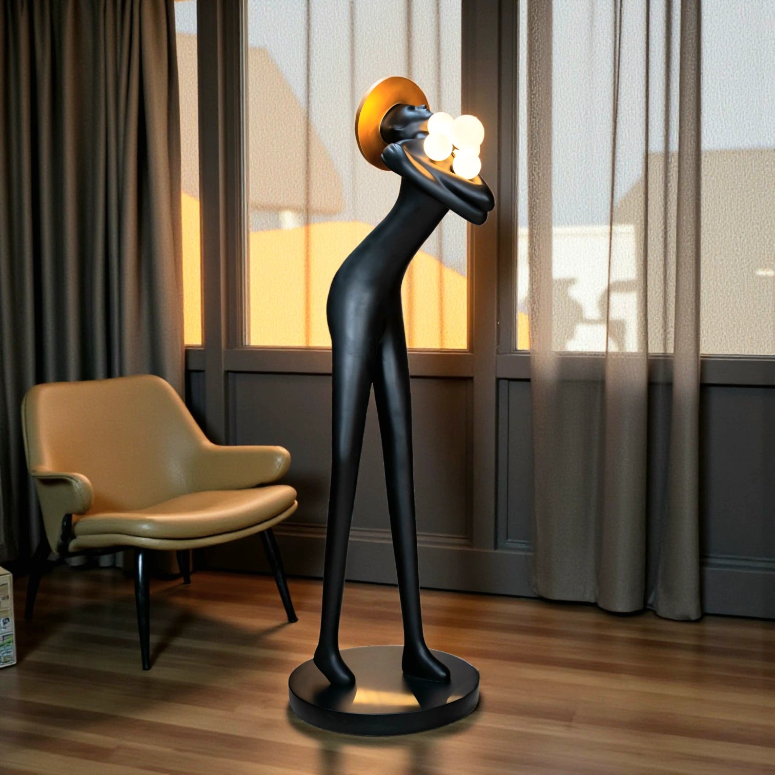 Tall black human-form floor sculpture holding glowing light orbs