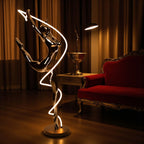 Metallic black human spiral floor sculpture with integrated LED light