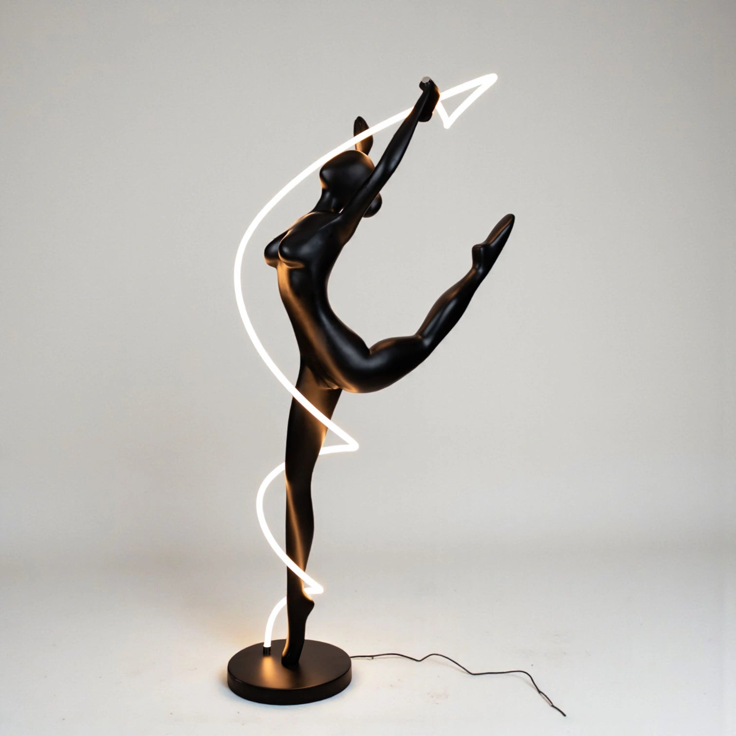 Matte black human figure sculpture with glowing spiral LED light