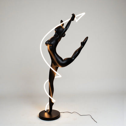 Matte black human figure sculpture with glowing spiral LED light
