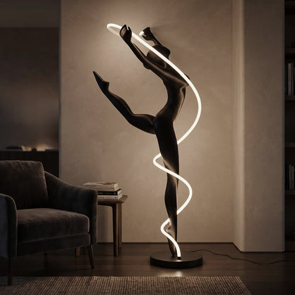 Matte black human figure sculpture with glowing spiral LED light