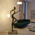 antique gold juggler sculptural floor lamp with orb lights