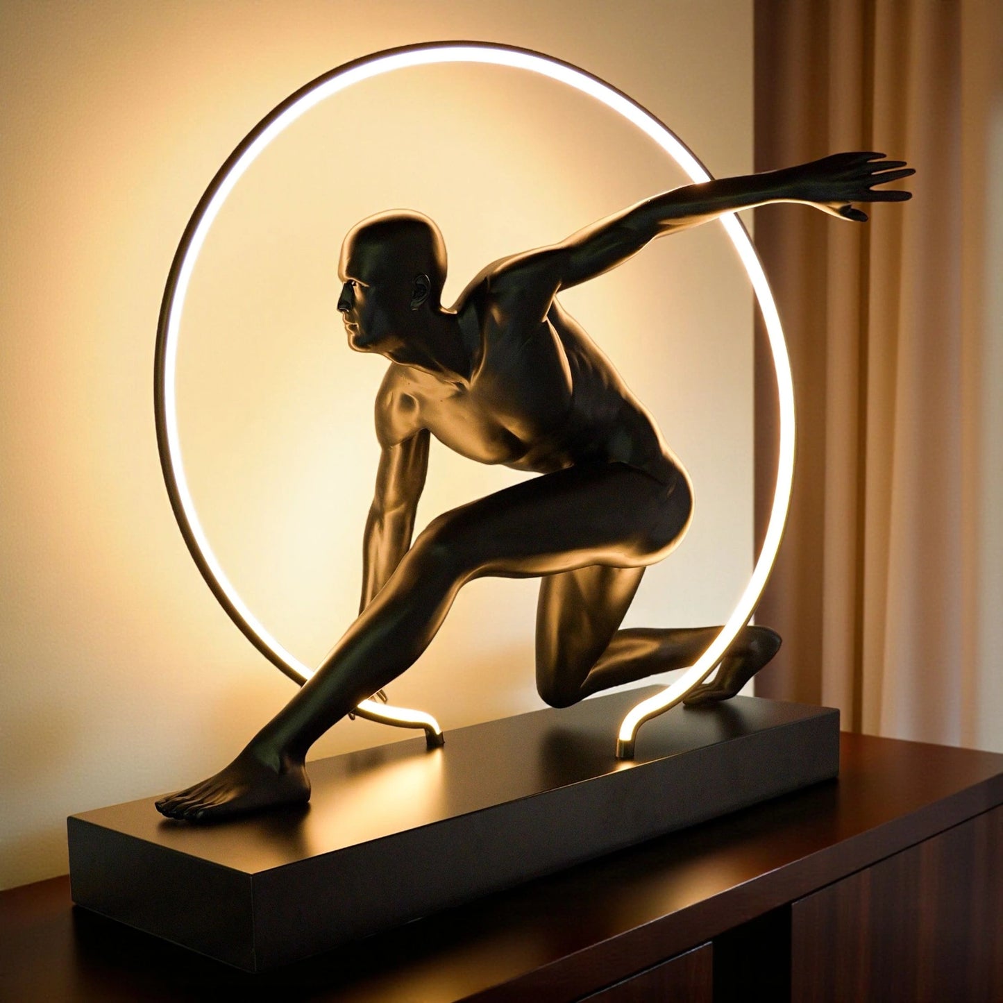 Matte black illuminated human motion sculpture with halo light ring on rectangular base