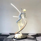 Liberty Sculpture Floor Lamp Standard Edition – silver and white human-form lamp with LED arcs and glowing orb.”