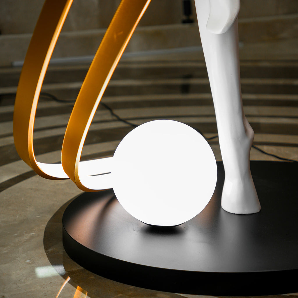 Liberty Sculpture Floor Lamp Standard Edition – silver and white human-form lamp with LED arcs and glowing orb.”