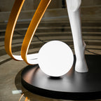 Liberty Sculpture Floor Lamp Standard Edition – silver and white human-form lamp with LED arcs and glowing orb.”