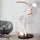 Liberty Sculpture Floor Lamp Standard Edition – silver and white human-form lamp with LED arcs and glowing orb.”