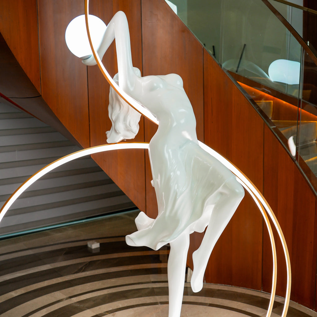 Liberty Sculpture Floor Lamp Standard Edition – silver and white human-form lamp with LED arcs and glowing orb.”