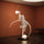 Liberty Sculpture Floor Lamp Standard Edition – silver and white human-form lamp with LED arcs and glowing orb.”