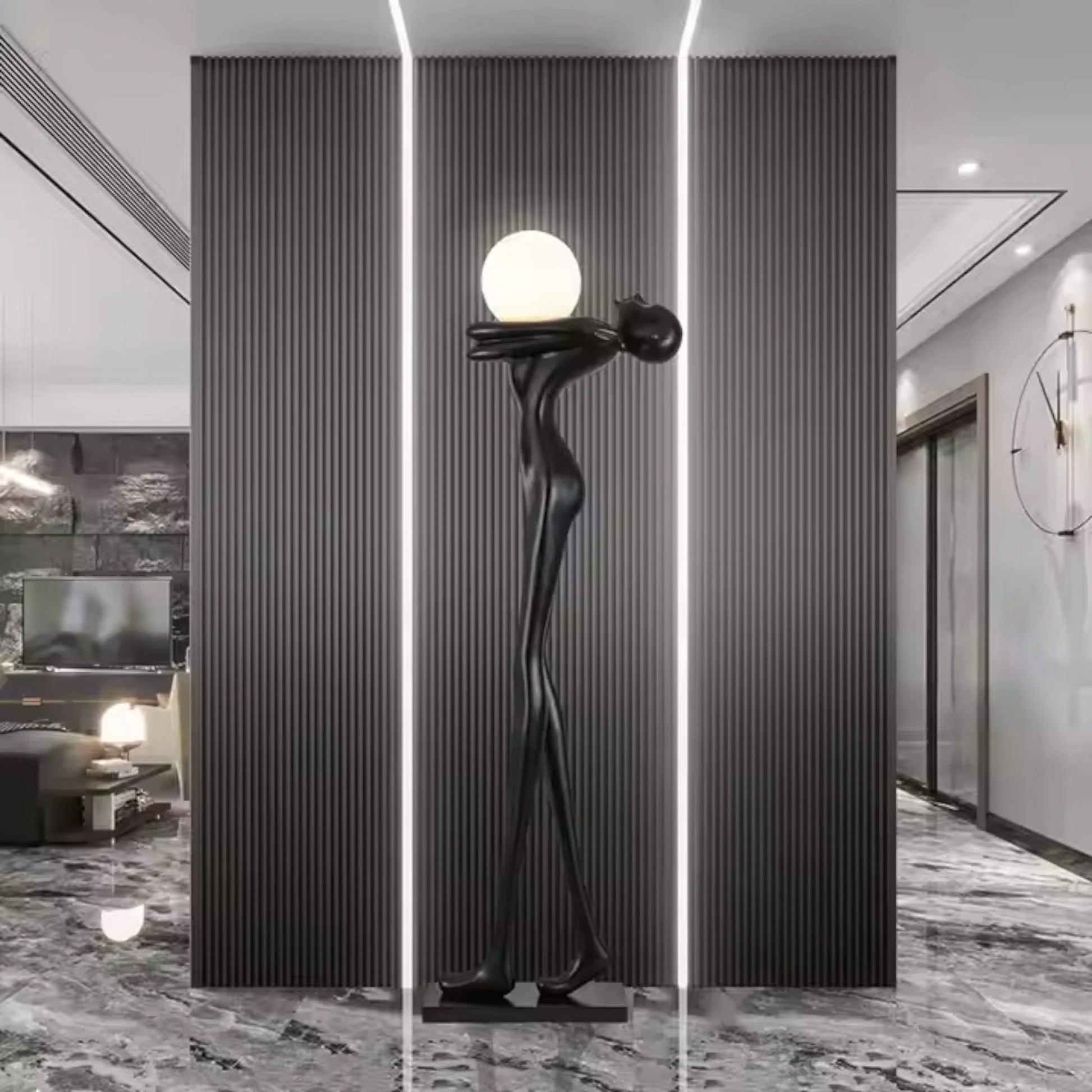Tall matte black human sculpture floor lamp holding a glowing orb in a modern interior setting.”