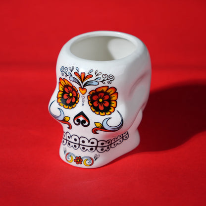 white ceramic skull glass with multicolor viking-style artwork