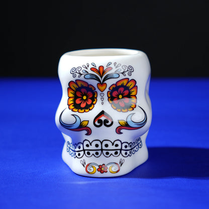 white ceramic skull glass with multicolor viking-style artwork