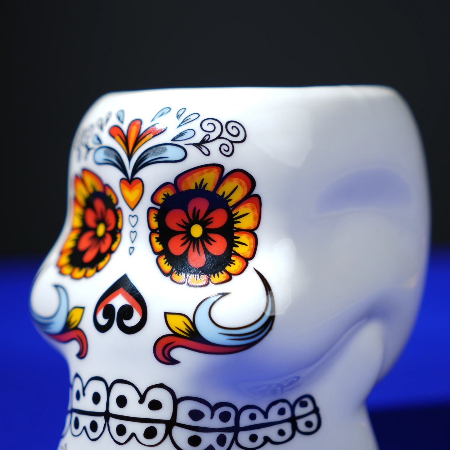 white ceramic skull glass with multicolor viking-style artwork