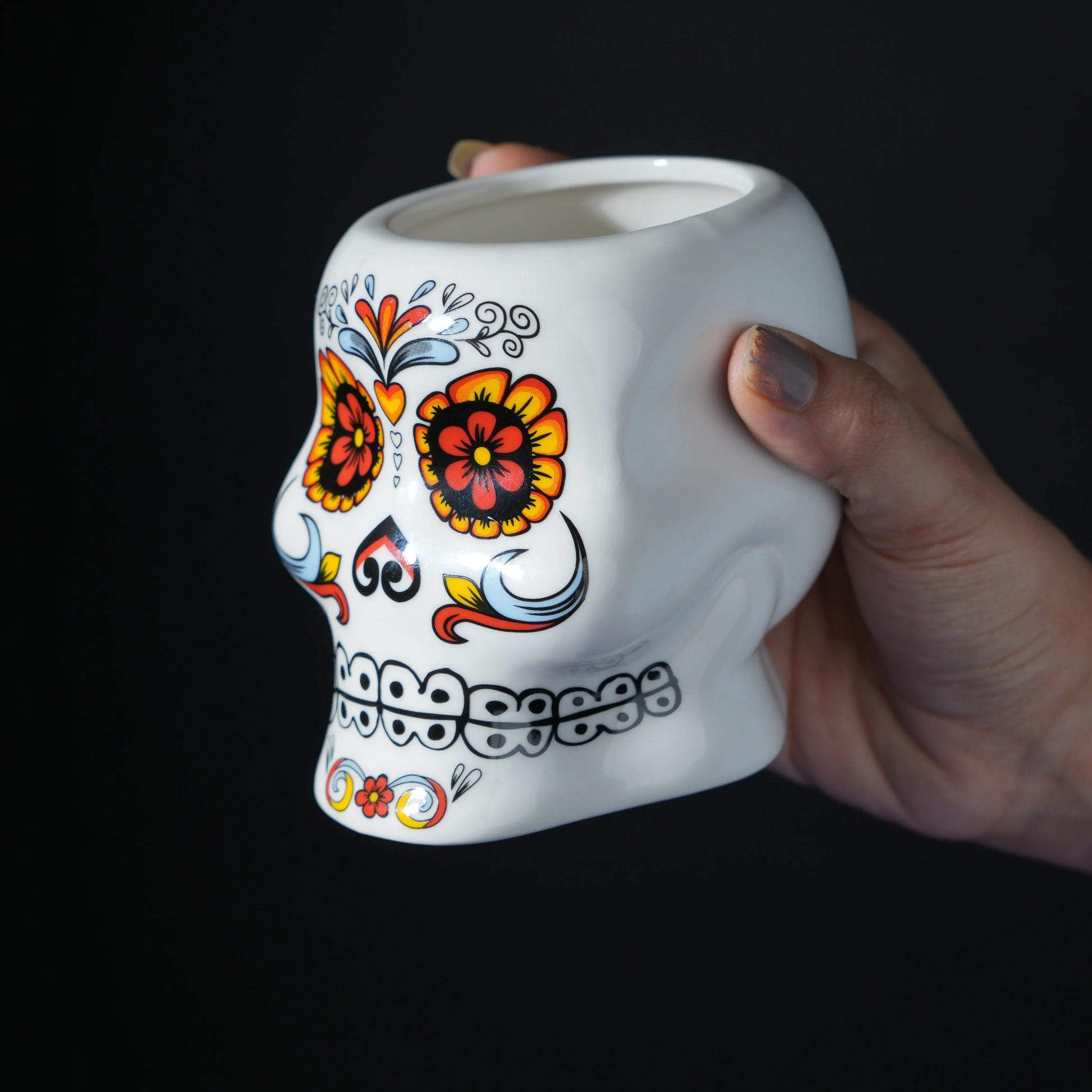 white ceramic skull glass with multicolor viking-style artwork